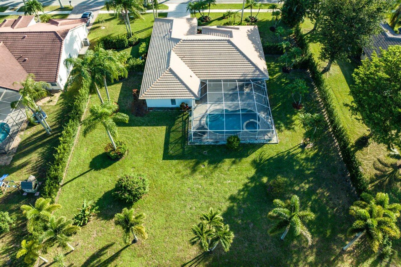 10374 Canoe Brook Circle Boca Raton, FL 33498 - Photo 5 of 41 a house view with a garden space