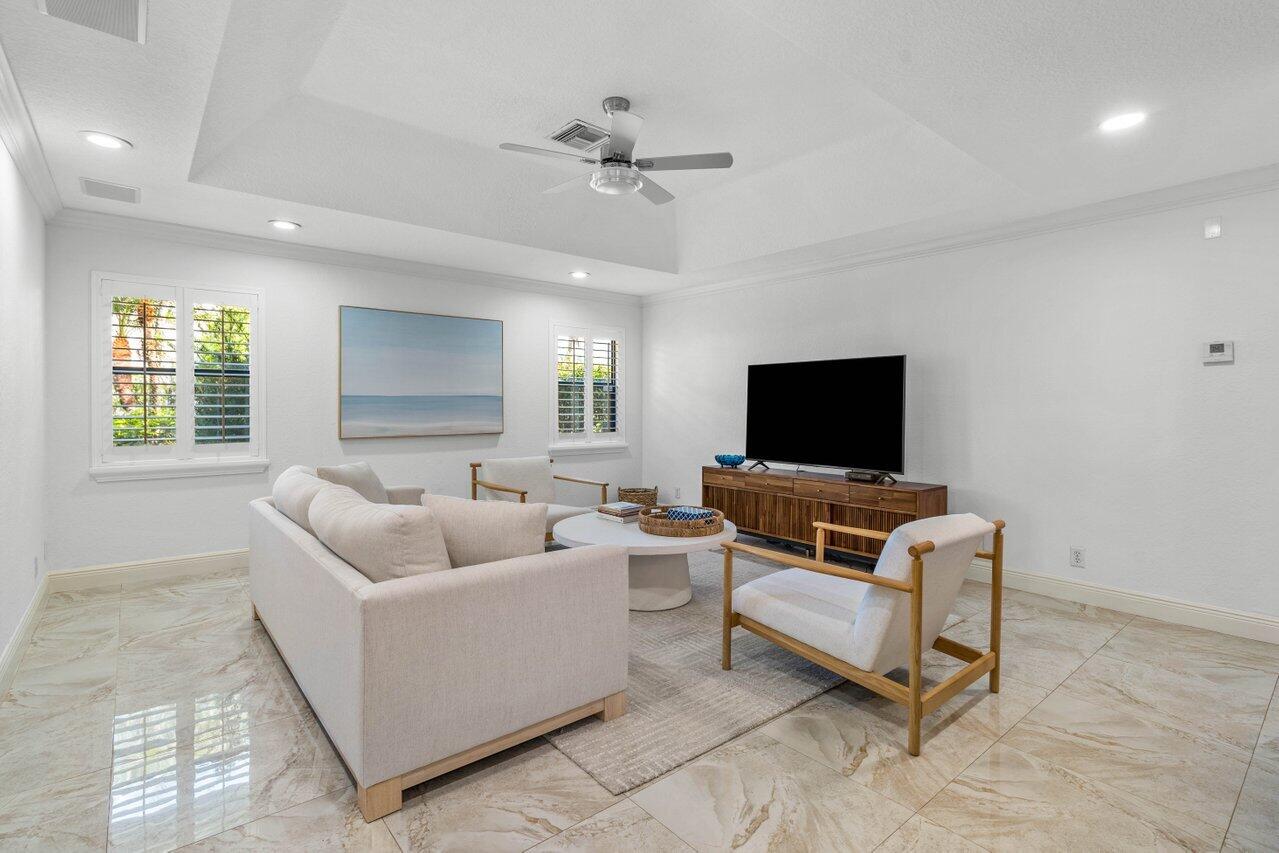 10374 Canoe Brook Circle Boca Raton, FL 33498 - Photo 7 of 41 a living room with furniture and a flat screen tv