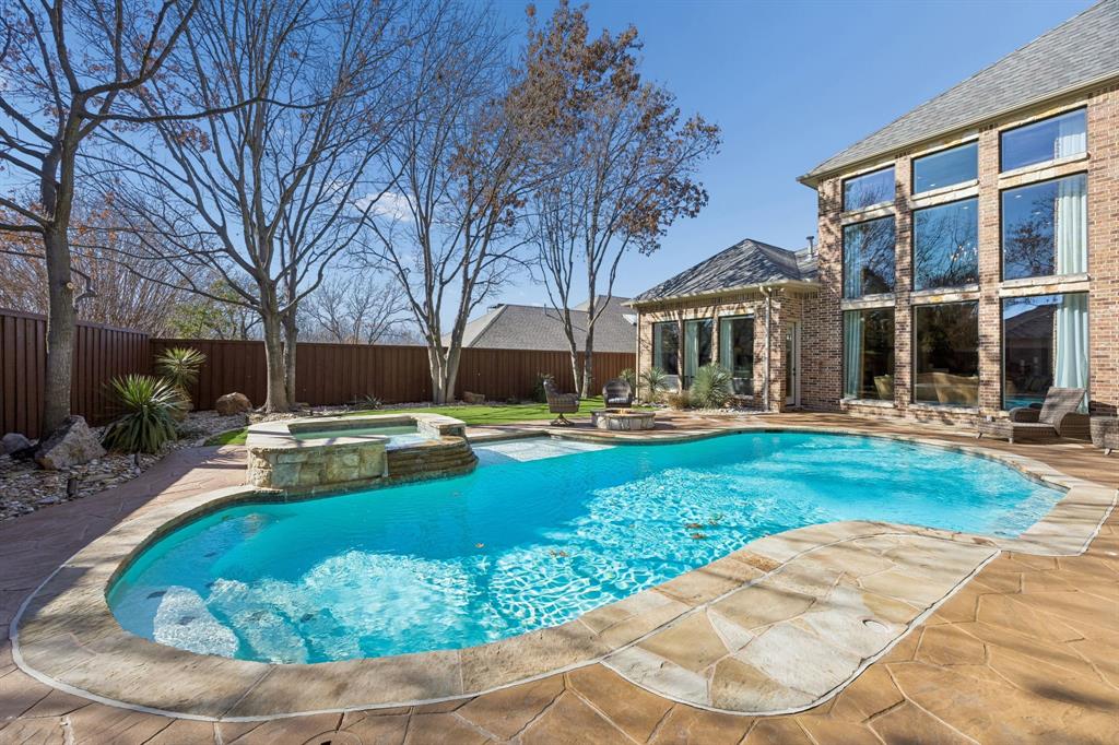 6640 Briar Ridge Lane Plano, TX 75024 - Photo 36 of 40 Pool/Sap and waterfall just off the covered patio area
