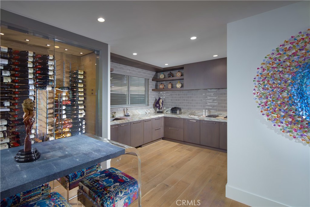 34385 Dana Strand Road, Unit B Dana Point, CA 92629 - Photo 11 of 45 a kitchen with stainless steel appliances wooden floor a sink and a refrigerator