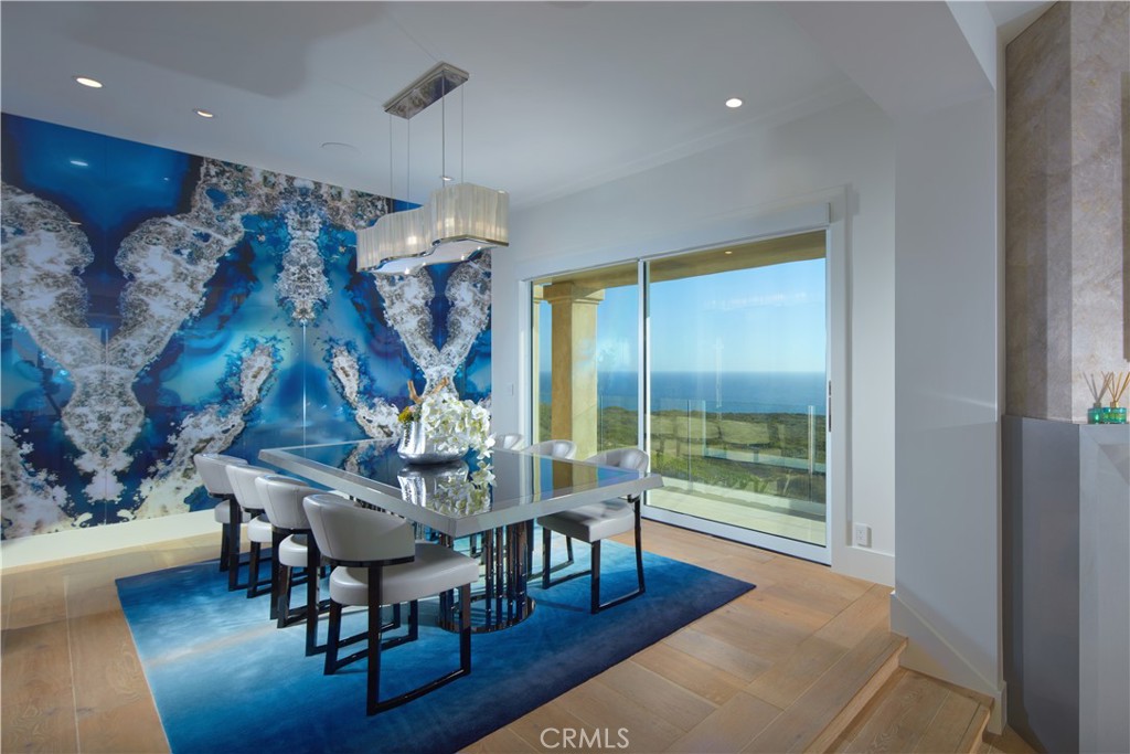 34385 Dana Strand Road, Unit B Dana Point, CA 92629 - Photo 13 of 45 a view of a dining room with furniture and wooden floor