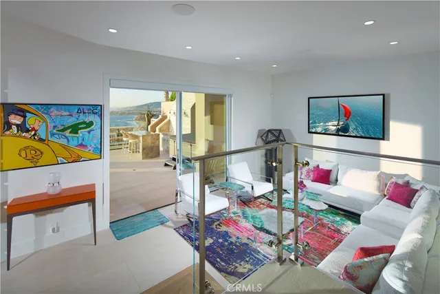 a bedroom with furniture and a large window