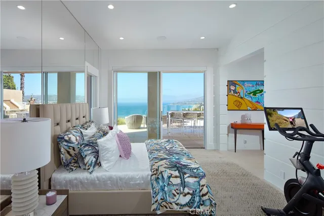 a dining table with a kitchen view