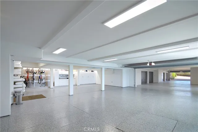 a view of parking garage with cars