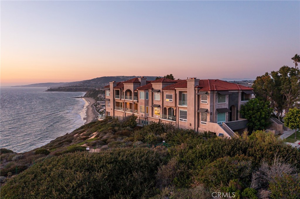 34385 Dana Strand Road, Unit B Dana Point, CA 92629 - Photo 38 of 45 a view of a houses with a yard and plants