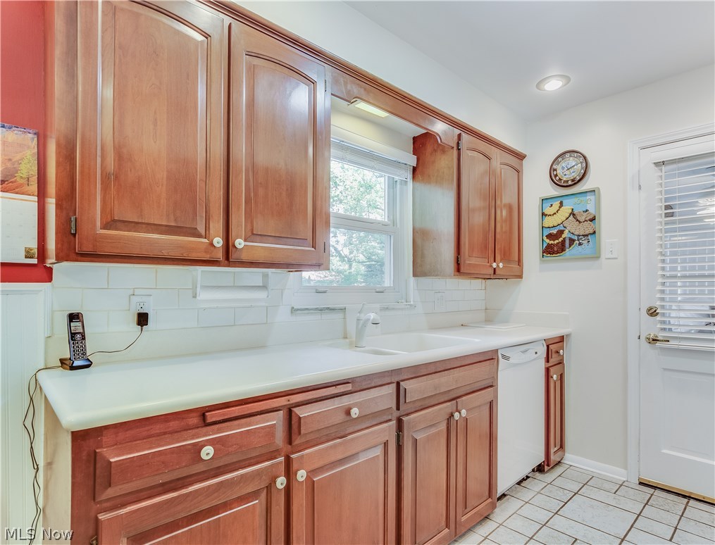 1072 Brandon Road Cleveland, OH 44112 - Photo 5 of 24 16 x 9 foot Kitchen features Beautiful Hardwood Cabinets and Corian Countertops.