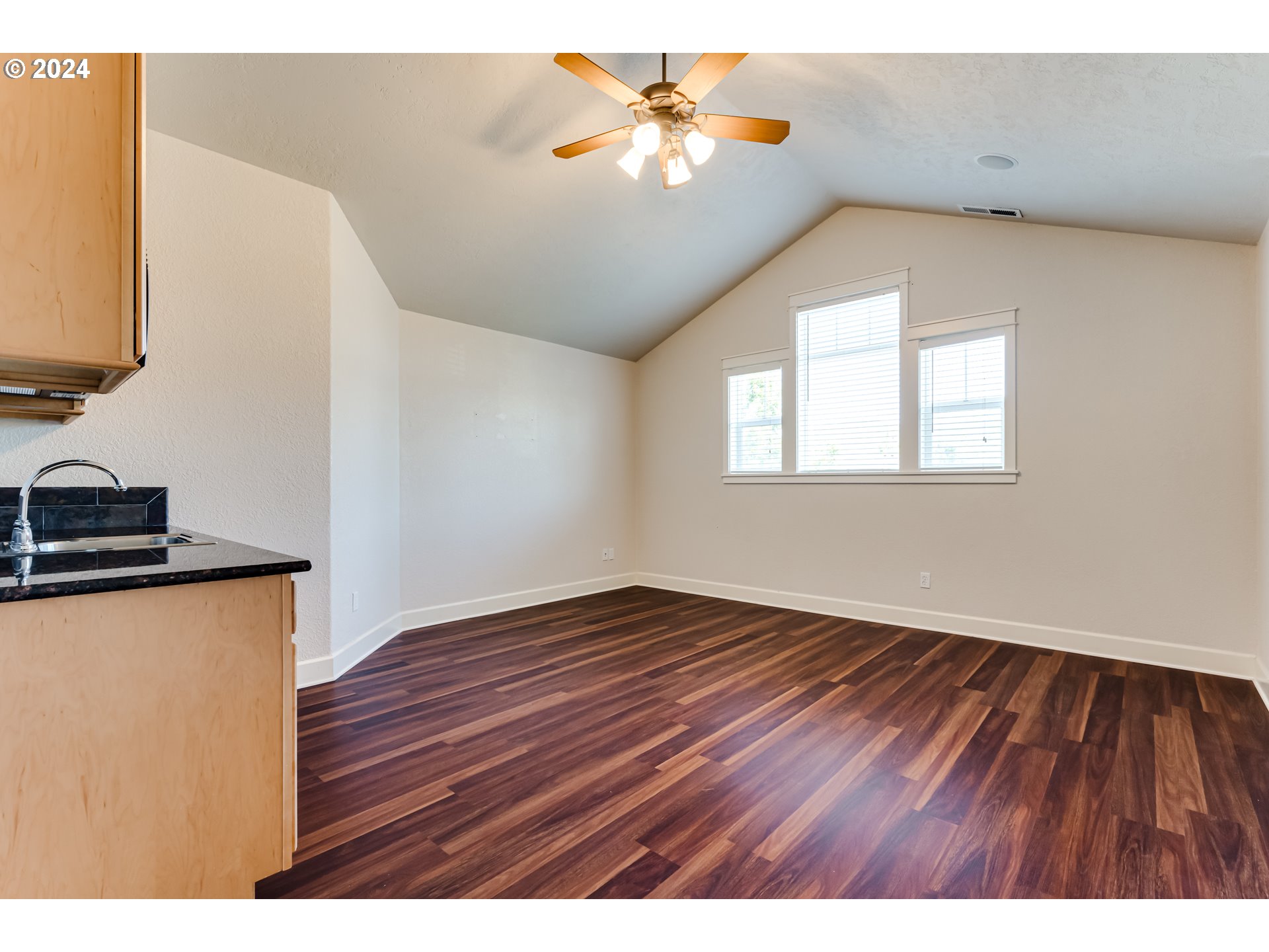 3313 Falcon Drive Springfield, OR 97477 - Photo 25 of 36 a view of an empty room with window and wooden floor