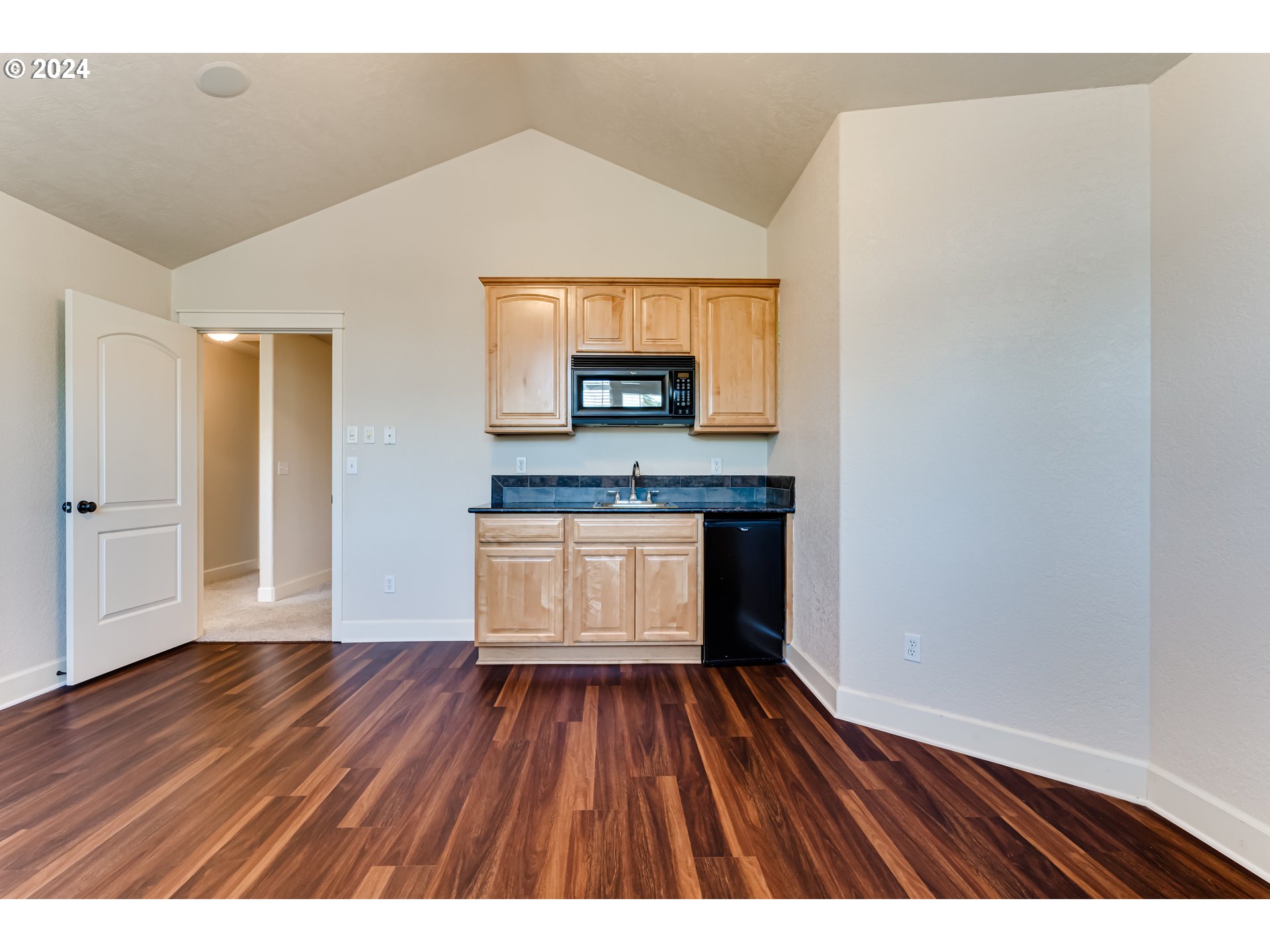3313 Falcon Drive Springfield, OR 97477 - Photo 26 of 36 a open kitchen with cabinets wooden floor and stainless steel appliances