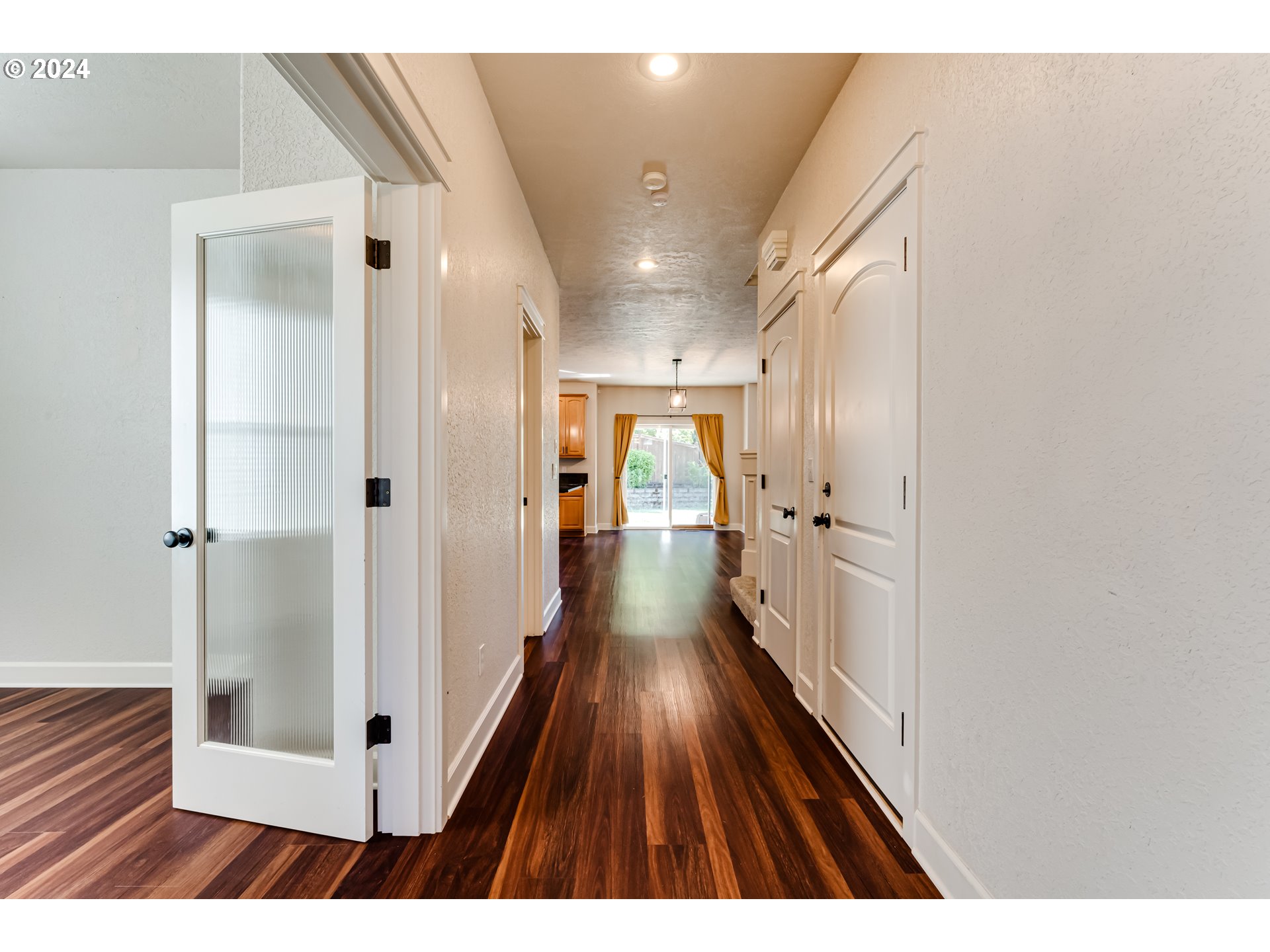 3313 Falcon Drive Springfield, OR 97477 - Photo 5 of 36 a view of a hallway with wooden floor