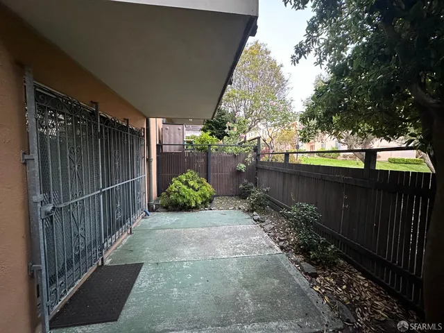 a view of a pathway of a backyard