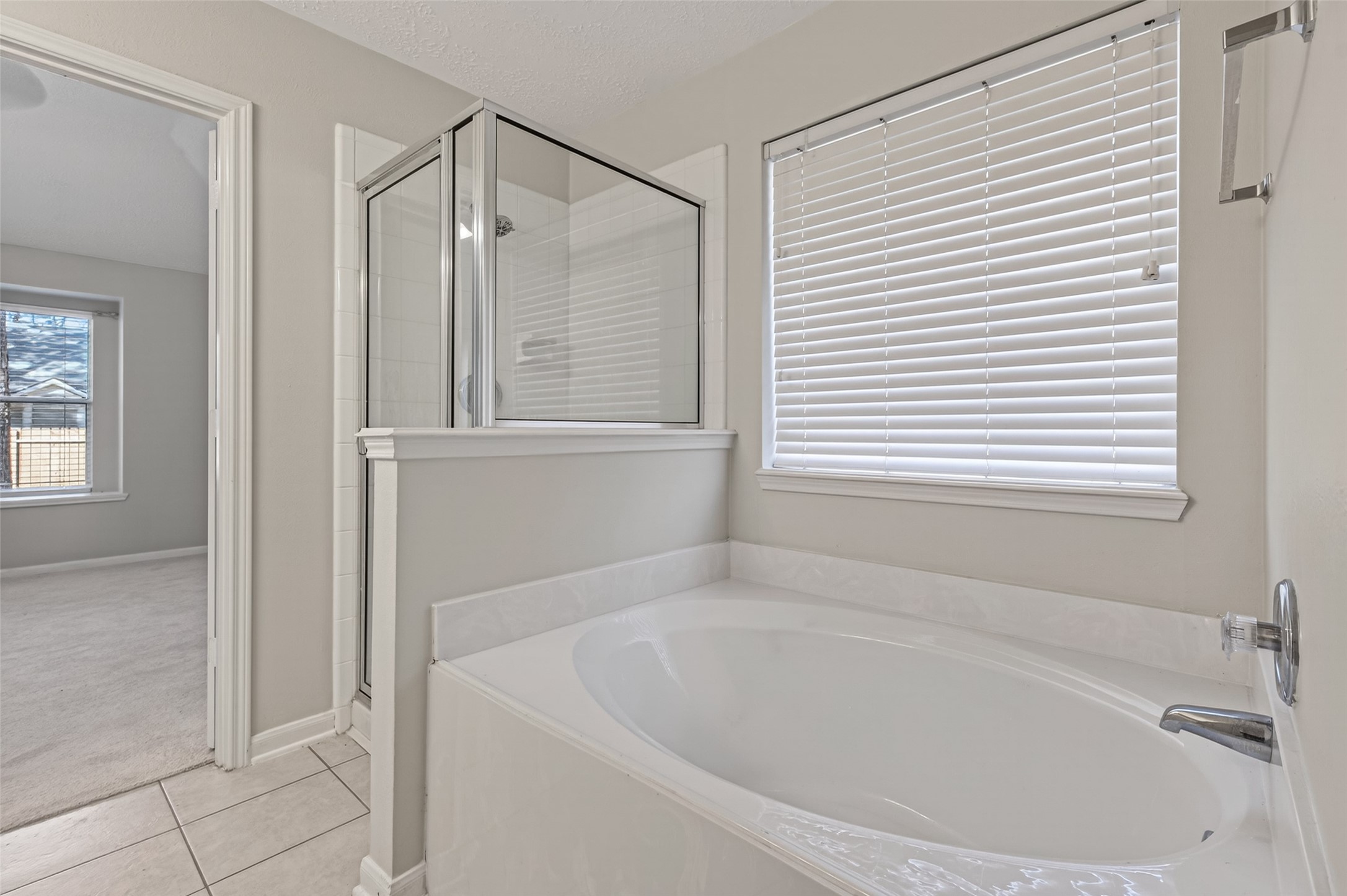 39 North Delta Mill Circle Conroe, TX 77385 - Photo 24 of 35 a white bath tub sitting next to a white sink