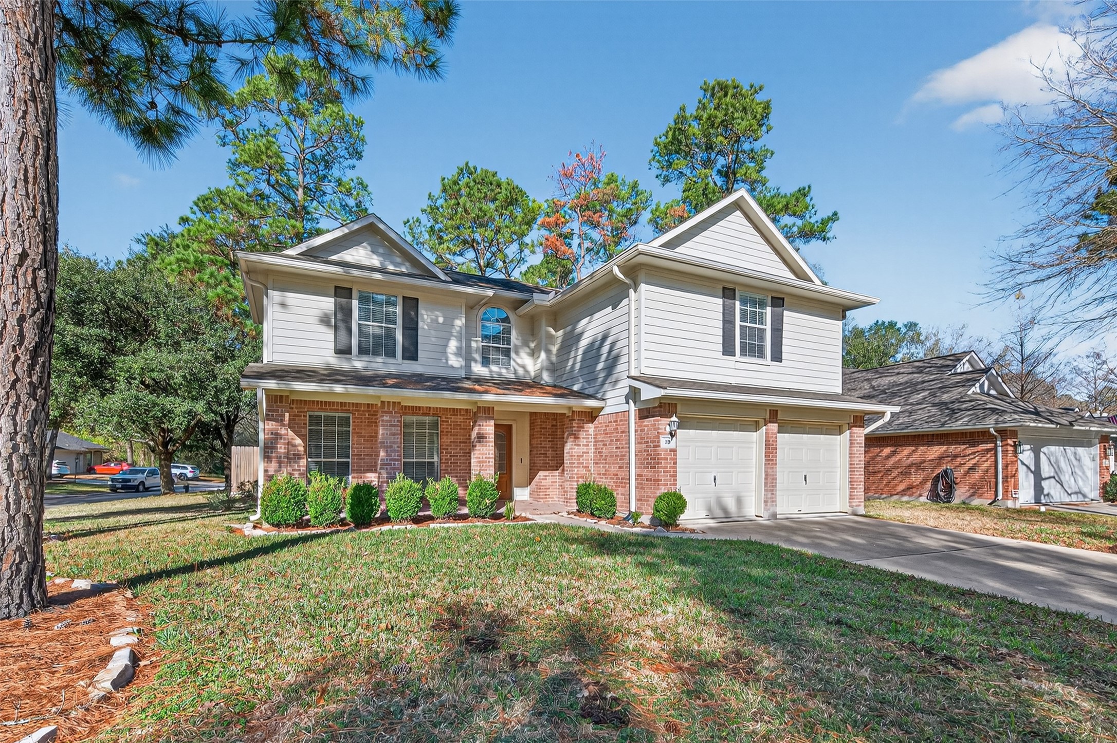 39 North Delta Mill Circle Conroe, TX 77385 - Photo 3 of 35 front view of house with a yard