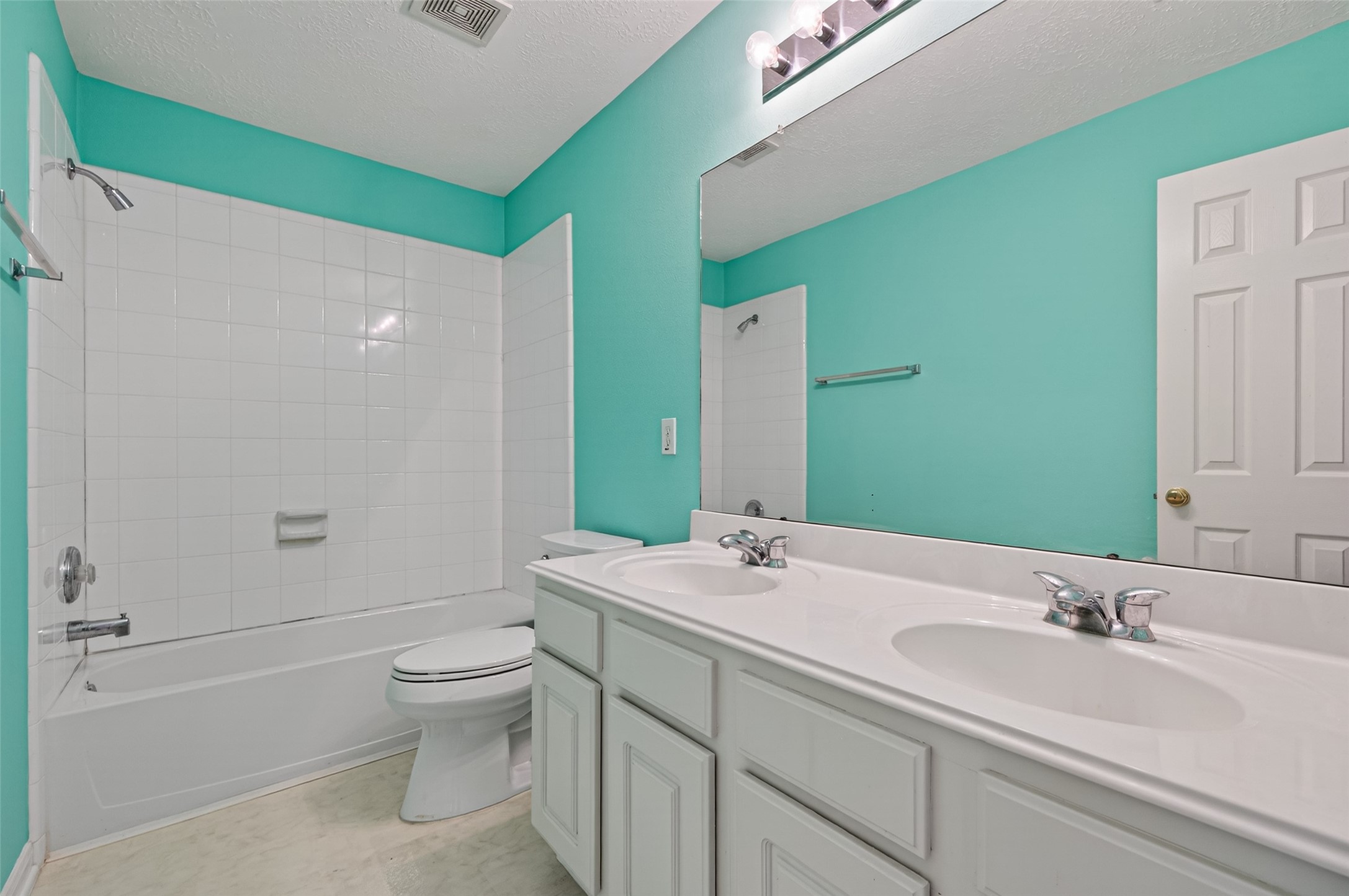 39 North Delta Mill Circle Conroe, TX 77385 - Photo 32 of 35 a bathroom with a double vanity sink toilet mirror and shower