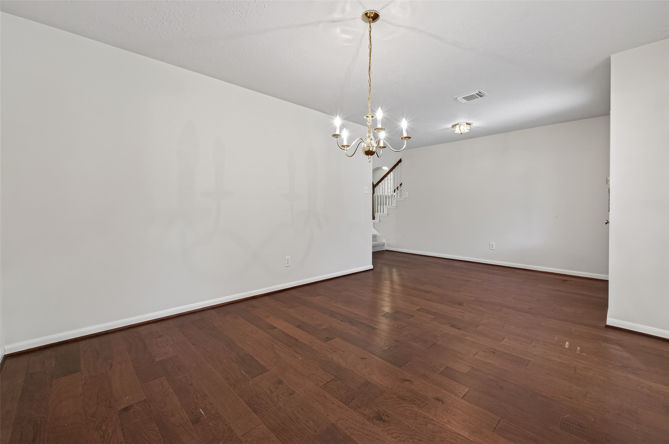 39 North Delta Mill Circle Conroe, TX 77385 - Photo 6 of 35 a view of an empty room with wooden floor