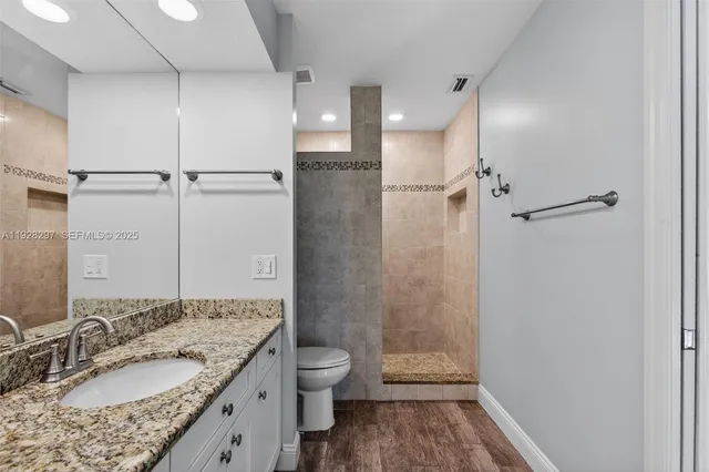 a kitchen with a sink cabinets and window