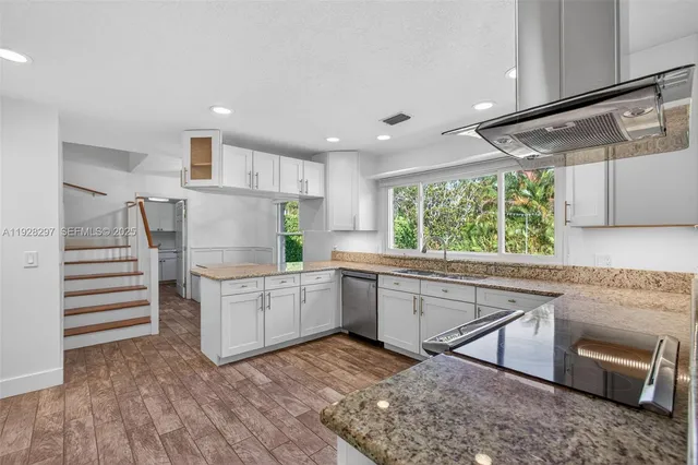 a front view of a house with a yard and porch