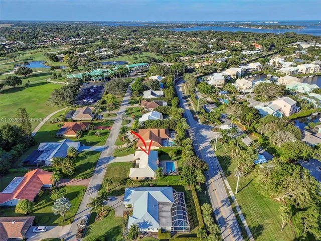 an aerial view of residential houses with outdoor space