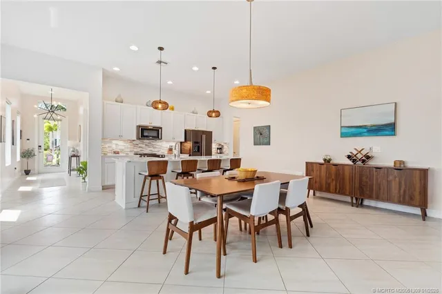 a bedroom with bed tv and window