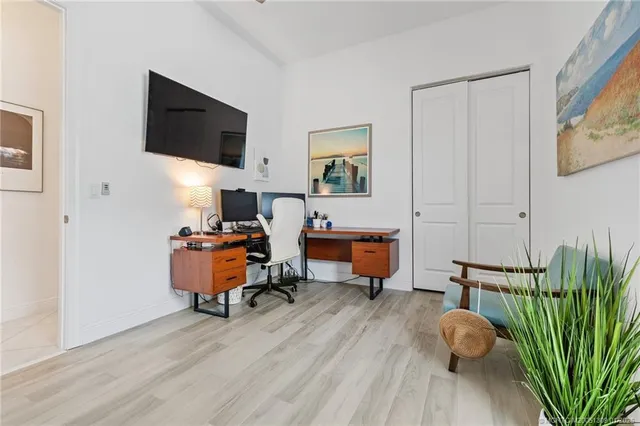 a view of a house with backyard and porch