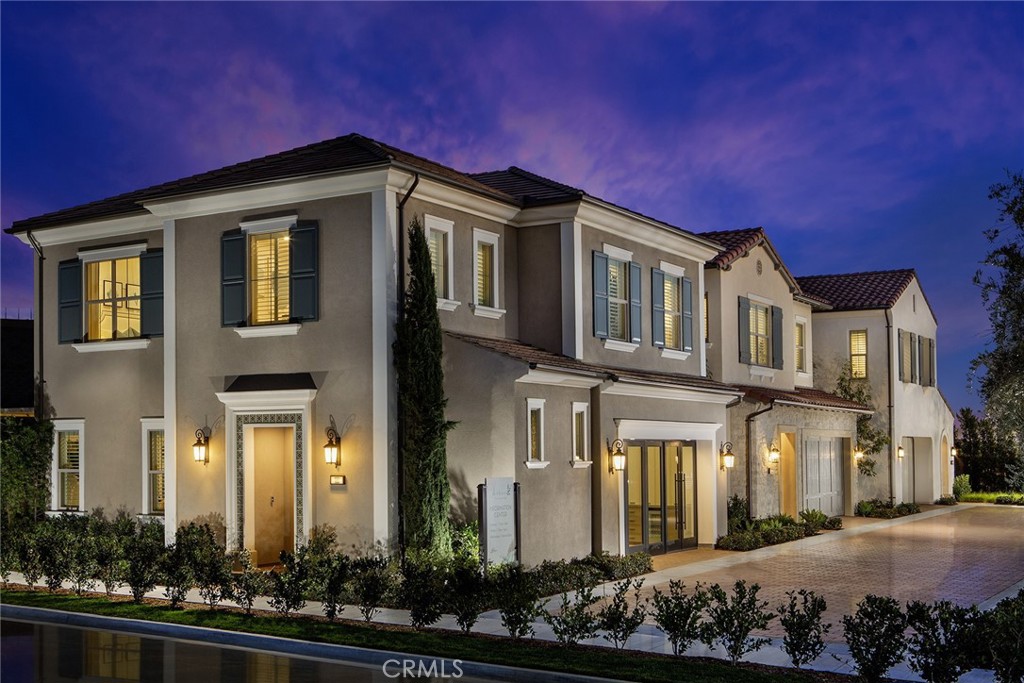 102 EVERSEDGE Irvine, CA 92618 - Photo 8 of 8 a front view of a house with lots of green space