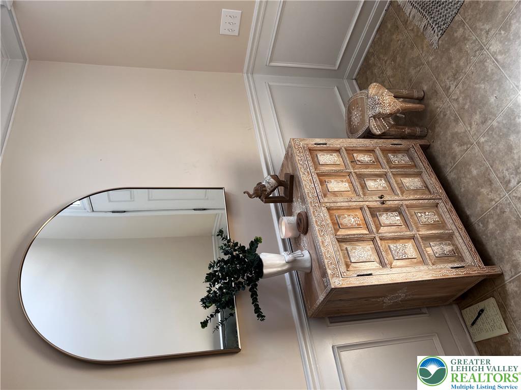 8549 Gateway Road Breinigsville, PA 18031 - Photo 3 of 26 Ornate wood details and wainscoting create an inviting entry point.