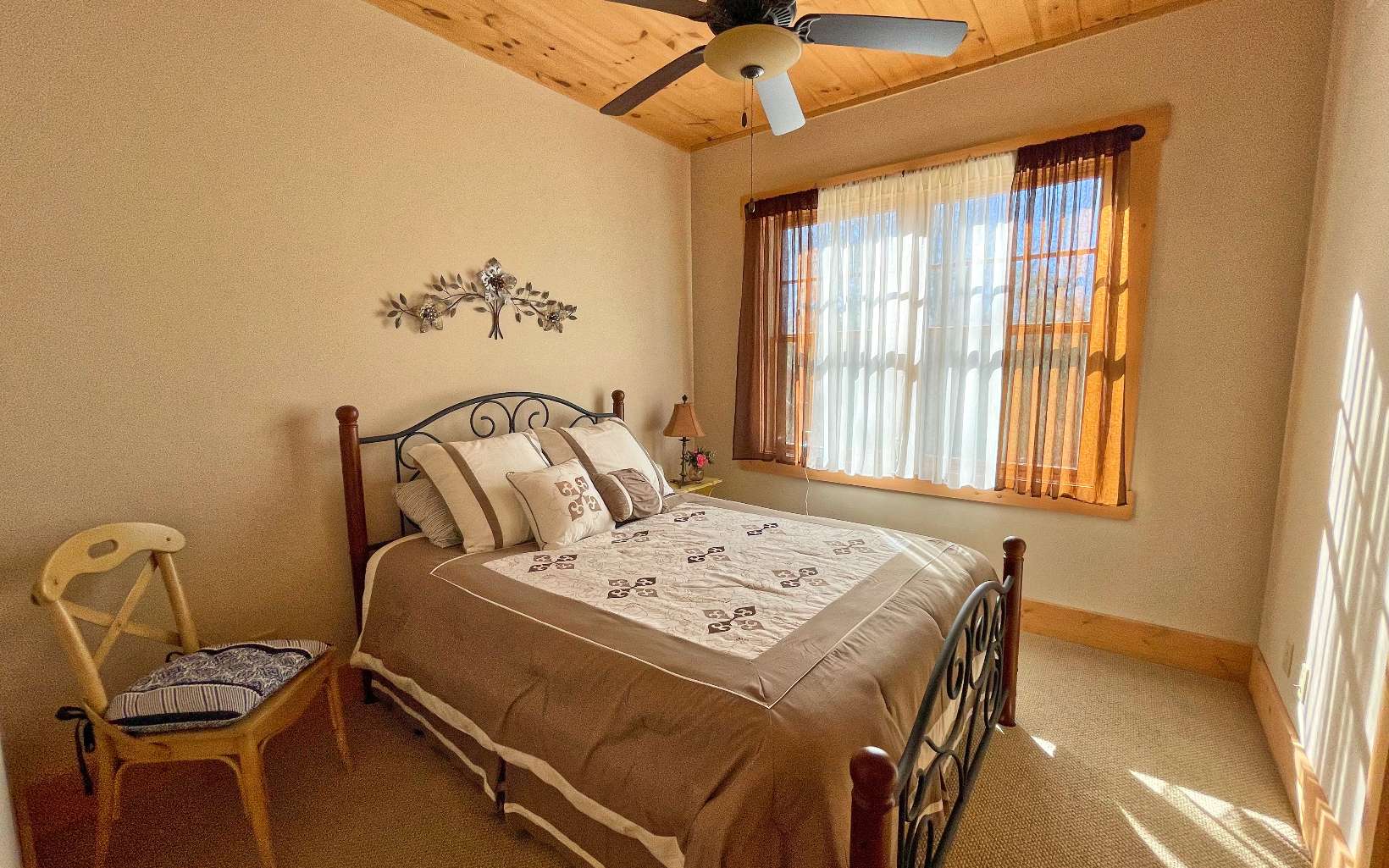111 Watkins Farm Road Blue Ridge, GA 30513 - Photo 24 of 44 a bed sitting in a bedroom next to a window