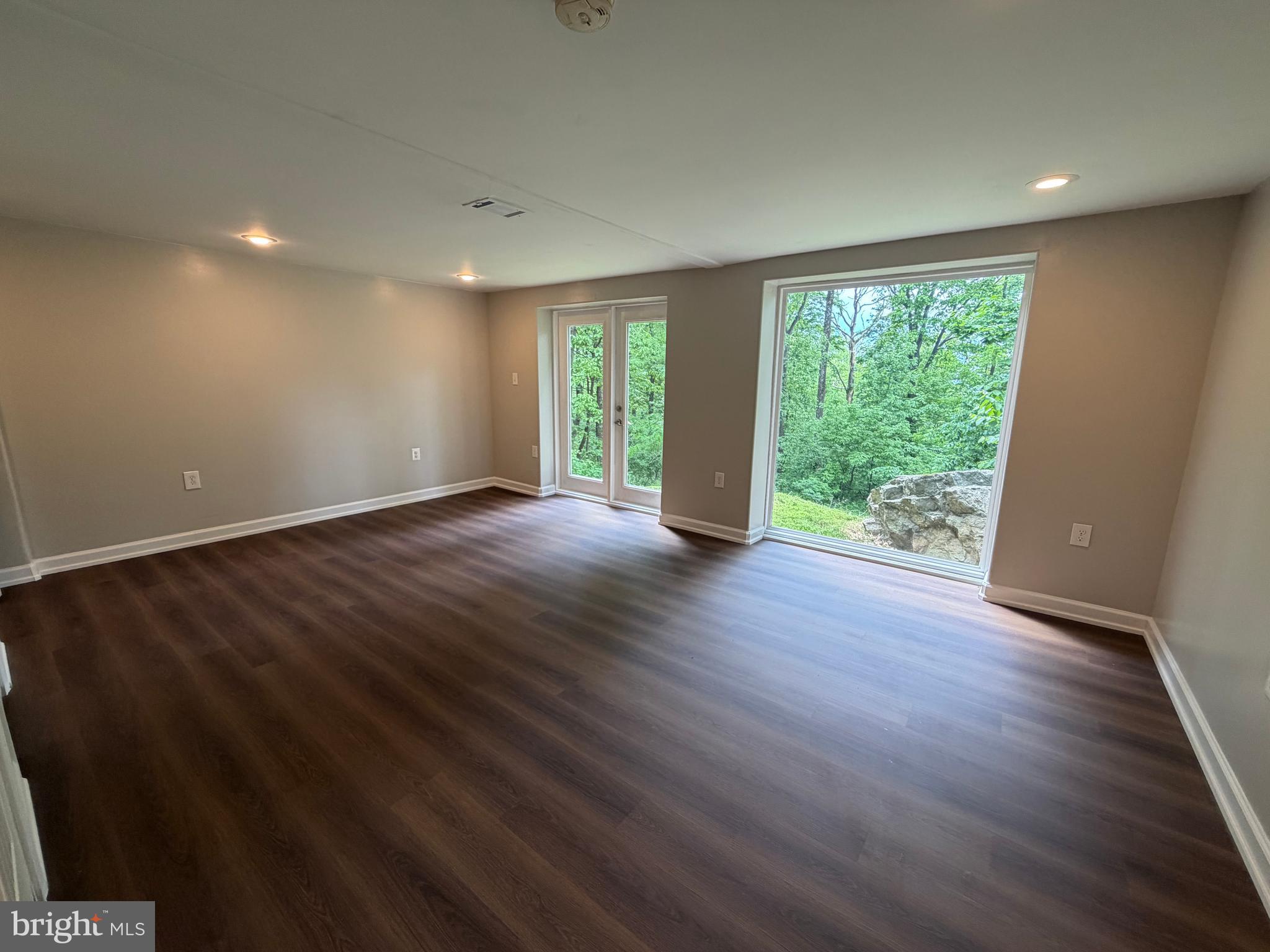 146 Trillium Trail Road Linden, VA 22642 - Photo 15 of 21 a view of an empty room with wooden floor and a window