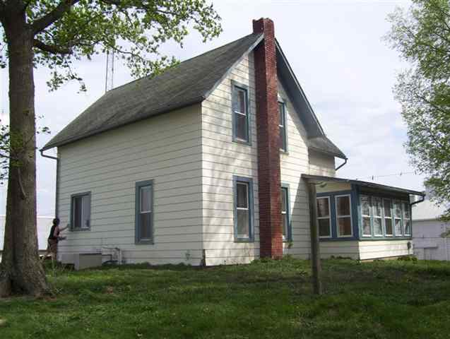 11680 Elston Road Fulton, IL 61252 - Photo 1 of 9 a view of backyard with a garden and plants