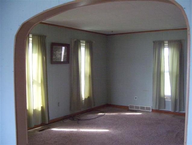 11680 Elston Road Fulton, IL 61252 - Photo 3 of 9 a view of an empty room with windows