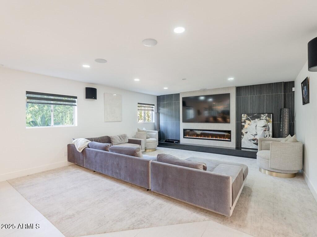 4748 East Redfield Road Phoenix, AZ 85032 - Photo 11 of 73 a living room with furniture and a flat screen tv