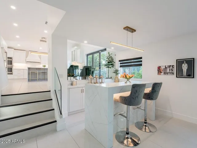 a kitchen with a stove a sink and a refrigerator