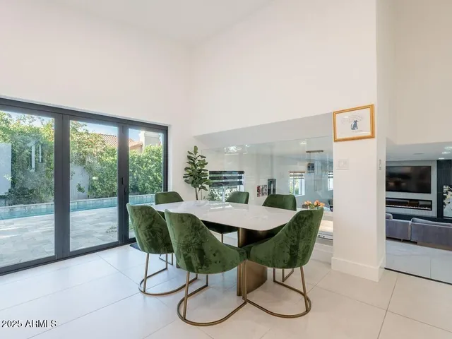 a bedroom with a bed window and flat screen tv