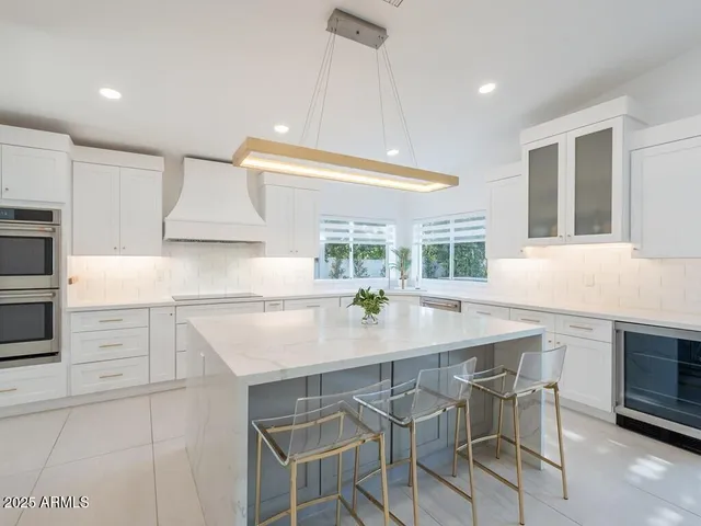 a bedroom with a bed and a potted plant