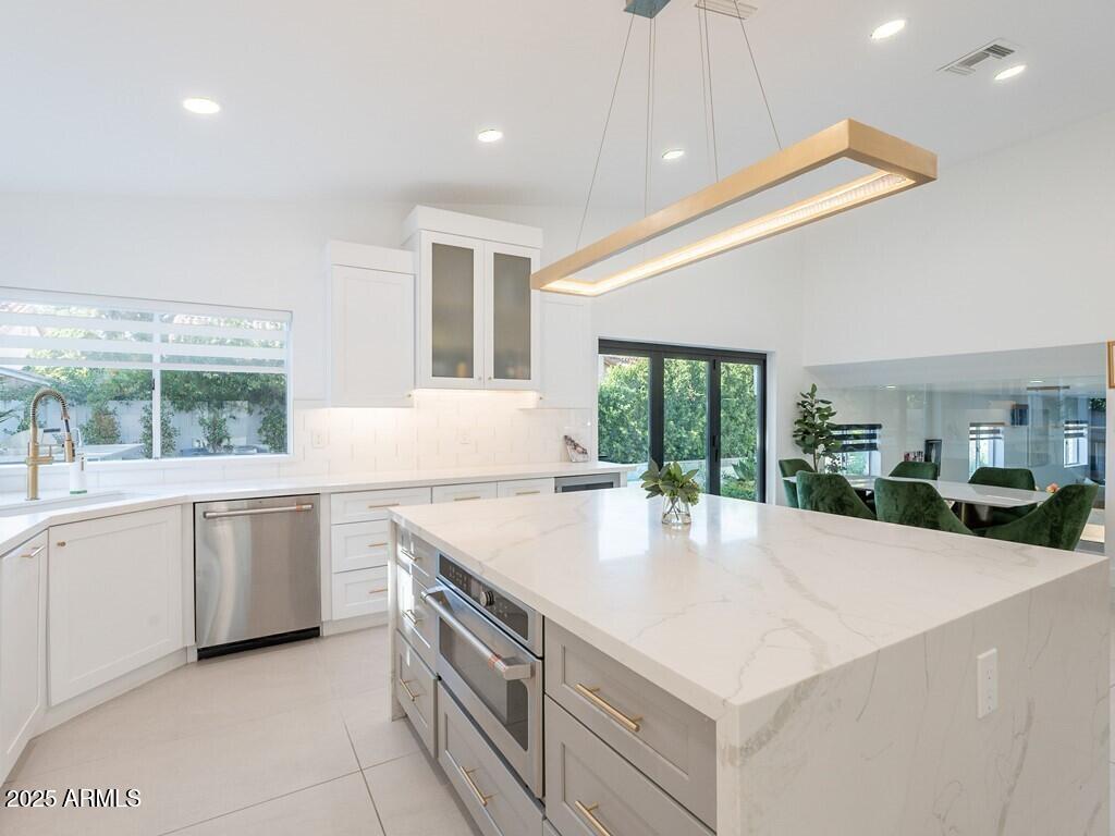 4748 East Redfield Road Phoenix, AZ 85032 - Photo 22 of 73 a kitchen with a stove a sink and a refrigerator