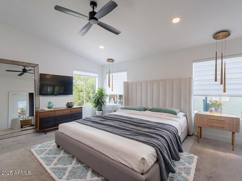 4748 East Redfield Road Phoenix, AZ 85032 - Photo 27 of 73 a bedroom with a bed window and flat screen tv