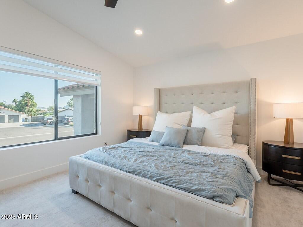 4748 East Redfield Road Phoenix, AZ 85032 - Photo 34 of 73 a bedroom with a large bed and a night stand