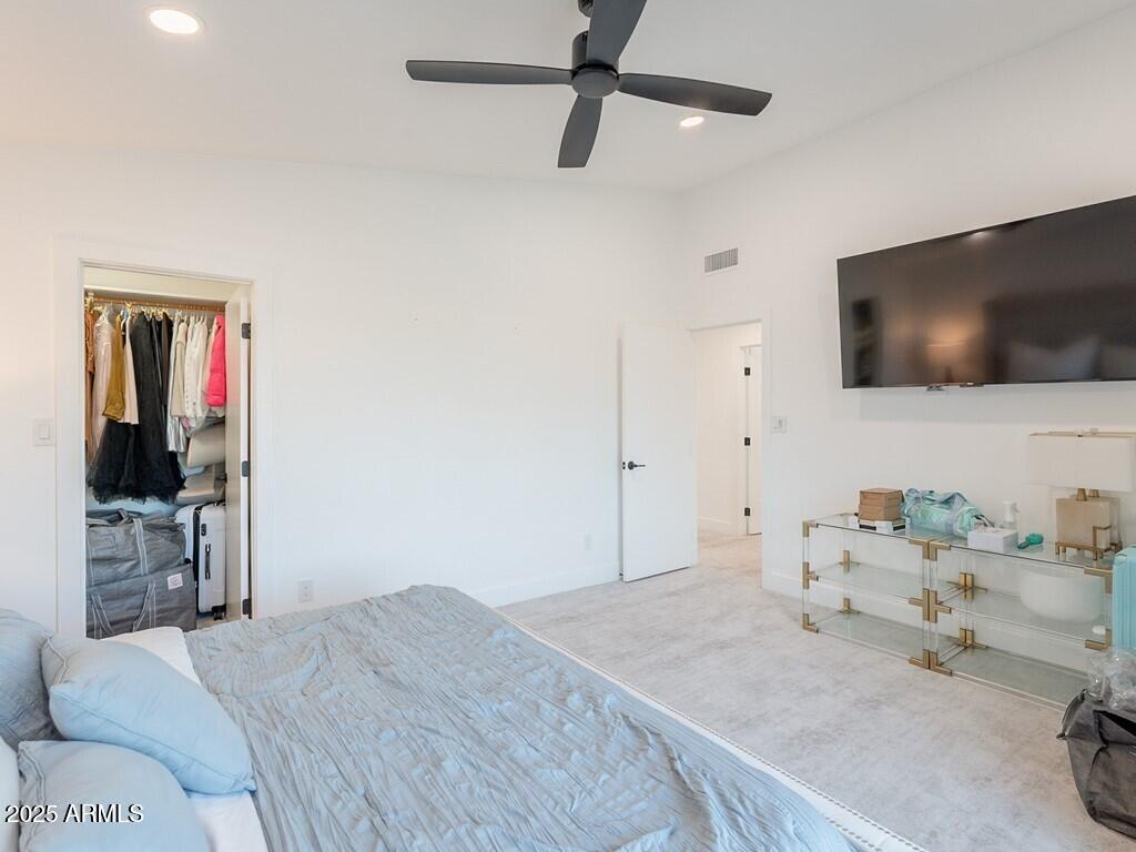 4748 East Redfield Road Phoenix, AZ 85032 - Photo 35 of 73 a bedroom with a bed and a flat screen tv