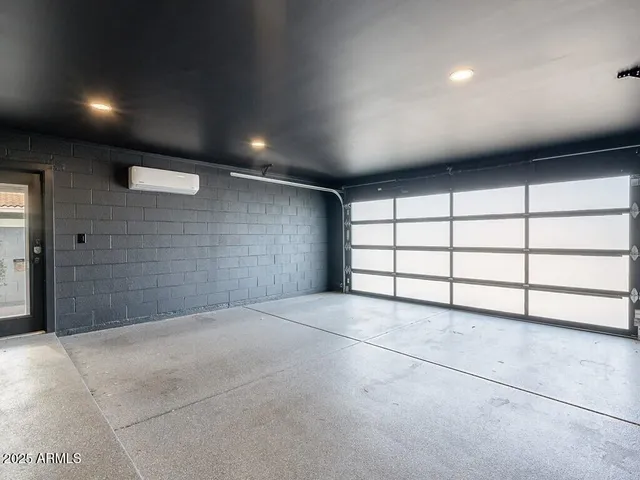 a kitchen with a stove a refrigerator and a dining table