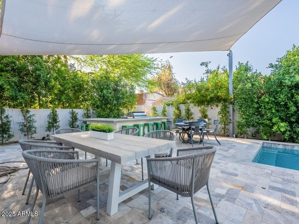 4748 East Redfield Road Phoenix, AZ 85032 - Photo 44 of 73 a outdoor dining space with furniture and garden view