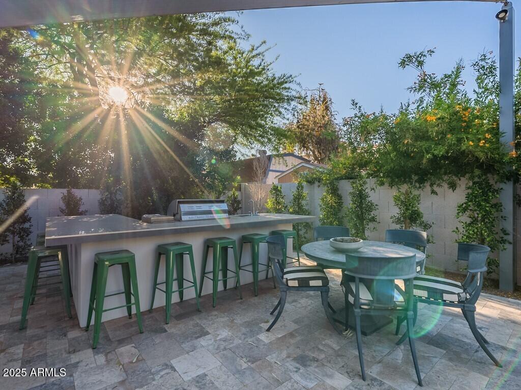 4748 East Redfield Road Phoenix, AZ 85032 - Photo 46 of 73 a view of a table and chairs in the patio