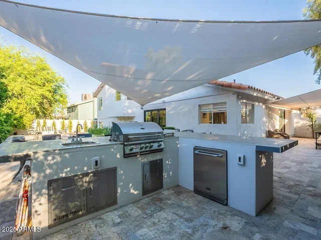 a view of a chairs and table in patio