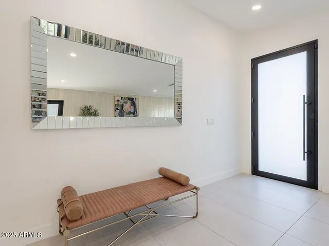 a living room with furniture and large window