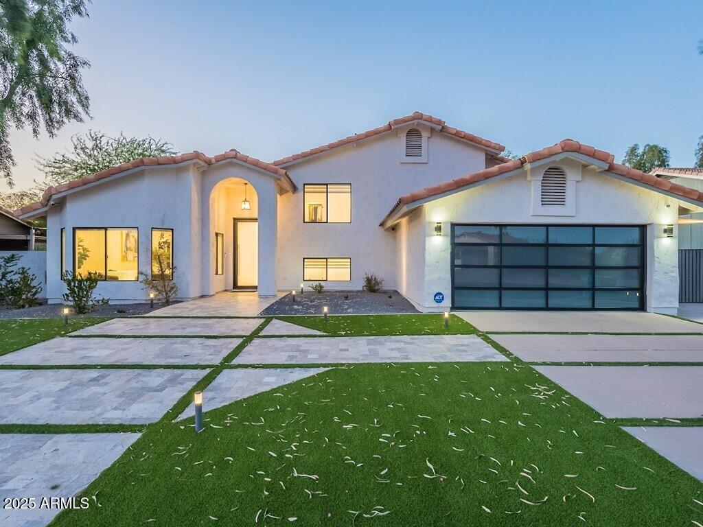 4748 East Redfield Road Phoenix, AZ 85032 - Photo 60 of 73 a front view of a house with a yard
