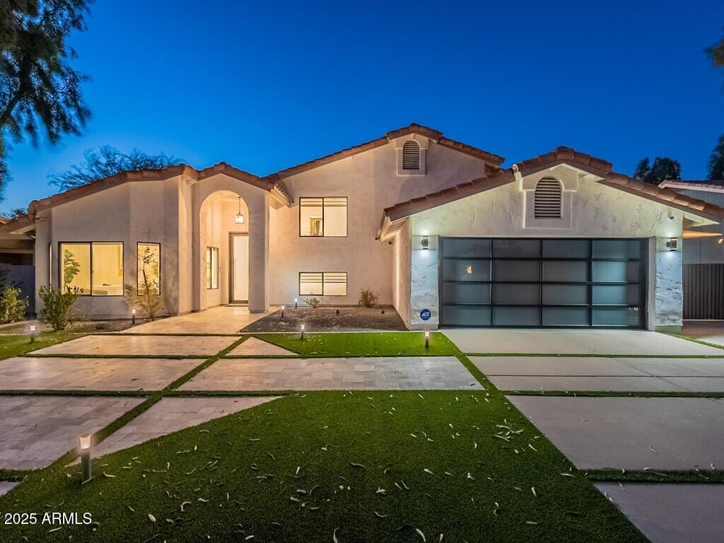 4748 East Redfield Road Phoenix, AZ 85032 - Photo 64 of 73 a front view of a house with a yard