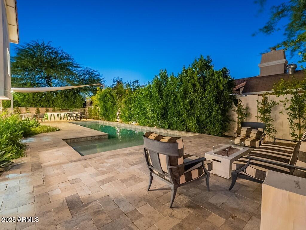 4748 East Redfield Road Phoenix, AZ 85032 - Photo 72 of 73 a view of a chairs and table in the patio