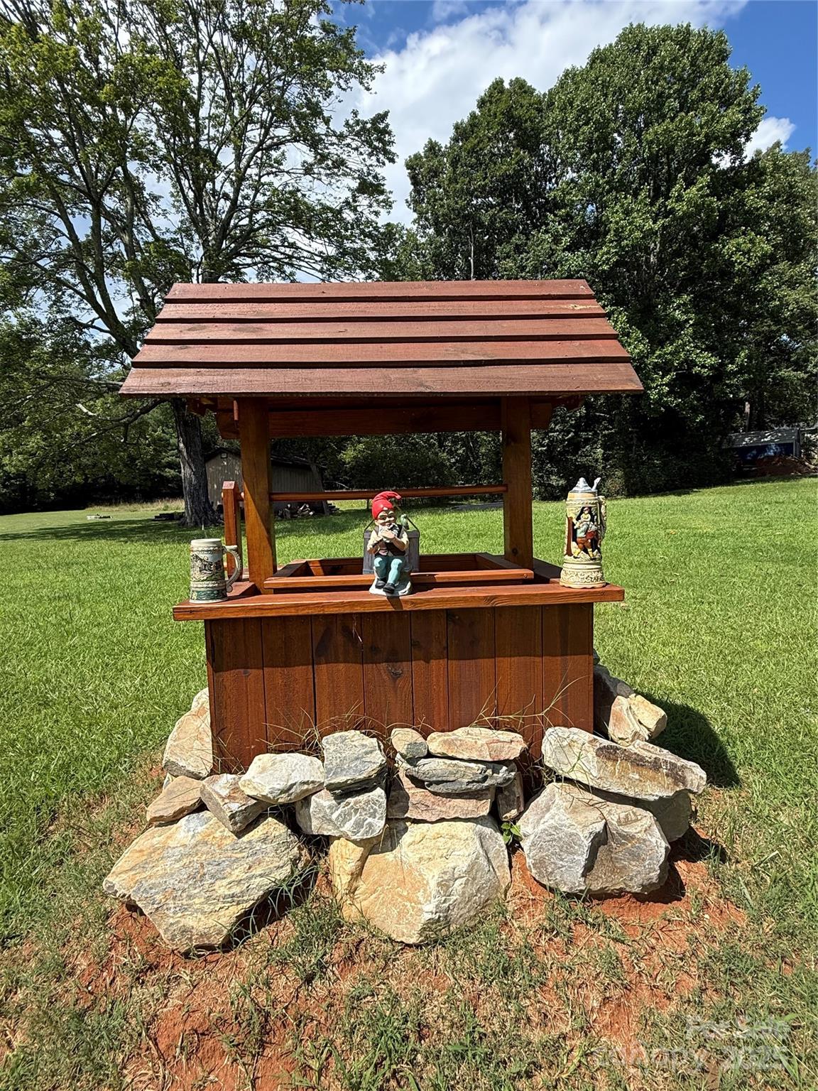 204 Vfw Road Morganton, NC 28655 - Photo 8 of 12 a backyard of a house with barbeque oven table and chairs