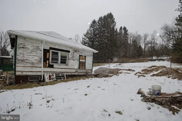 a view of a backyard of the house
