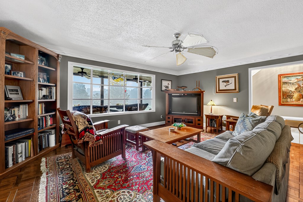 167 Whispering Pne Lane Cherry Log, GA 30522 - Photo 3 of 87 a living room with furniture a bookshelf and a window