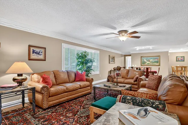 a view of a hallway with paintings on the wall