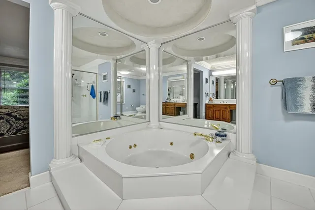 a view of a house with a yard and sitting area